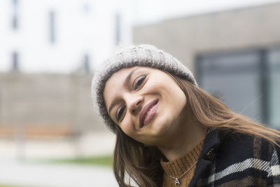 Face of a young woman with winter cap