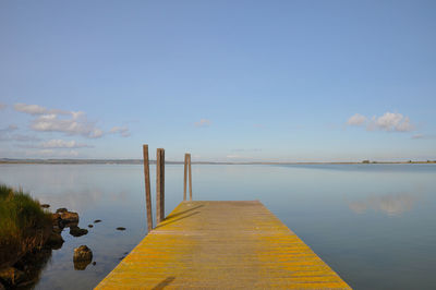 Pier on sea against sky