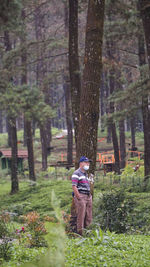 Rear view of man standing in park