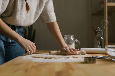 Young woman making christmas cookies