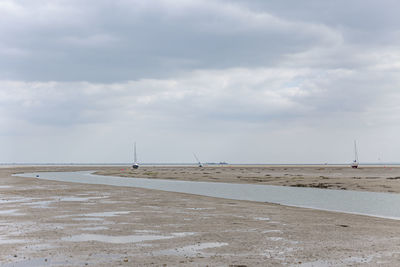 Fisherman boats stuck on the beach in low tide period in leigh-on-sea, uk.