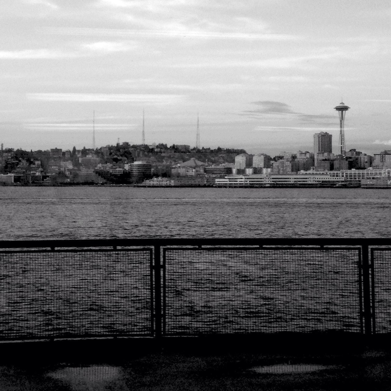 water, building exterior, architecture, built structure, sky, city, river, sea, cityscape, cloud - sky, railing, cloud, day, rippled, outdoors, pier, lake, no people, nature, tower