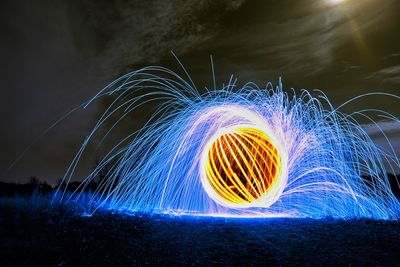 Light painting against sky at night