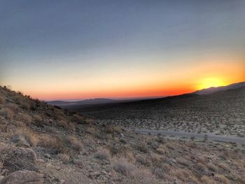 Scenic view of landscape against sky during sunset