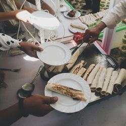 Cropped image of man serving kebabs during wedding ceremony