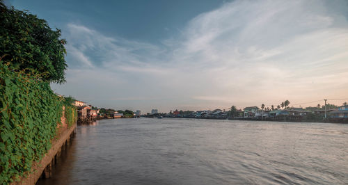 Scenic view of sea against sky in city