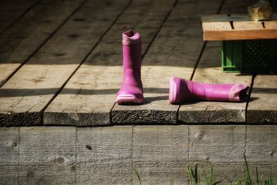 High angle view of pink can on wooden table