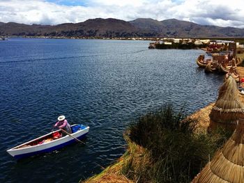 High angle view of woman boating on lake