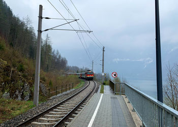Train on railroad track against sky