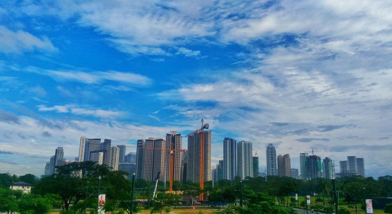 MODERN BUILDINGS AGAINST SKY