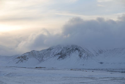 Scenic view of mountains against sky during winter