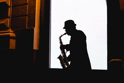 Silhouette of man working