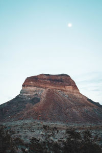 Rock formation on land against sky