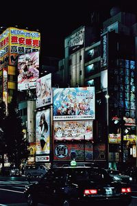 Illuminated city street at night