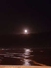 Scenic view of sea against sky at night