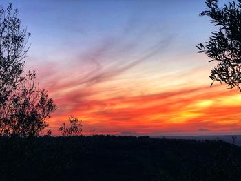 Scenic view of dramatic sky during sunset