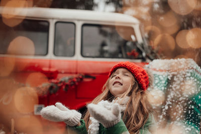 Portrait of smiling young woman in car