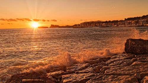 Scenic view of sea against sky during sunset