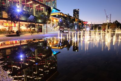 Illuminated buildings in city at night