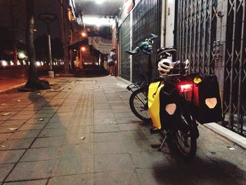 Bicycle on illuminated city at night