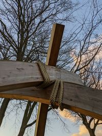 Low angle view of bare tree against sky during winter