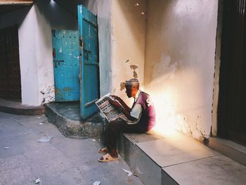 Side view of a young man sleeping on floor