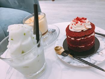 View of cake with ice cream on table