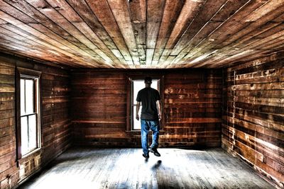 Full length of young man walking in building