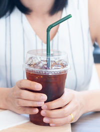 Close-up of woman drinking glass