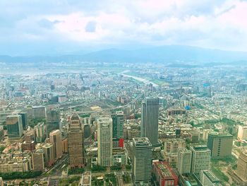 High angle view of modern buildings in city against sky