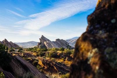 Scenic view of mountains against cloudy sky