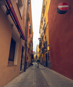 Street amidst buildings against sky