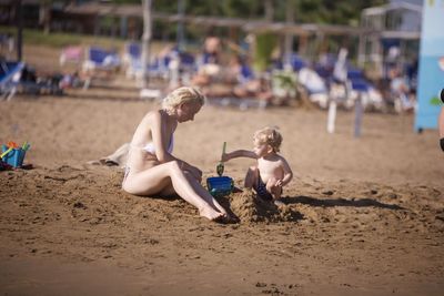 High angle view of boy playing at beach