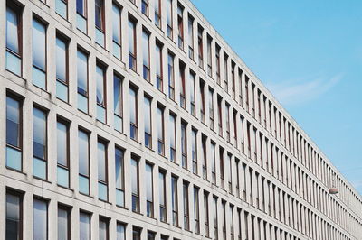 Low angle view of office building against sky