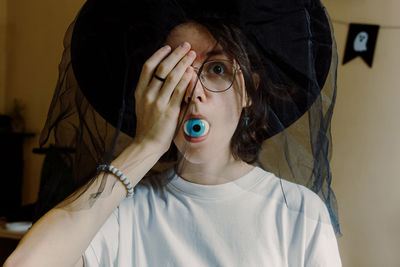 Close-up of woman wearing hat