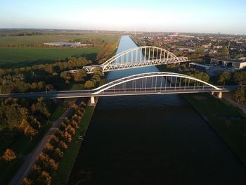 High angle view of bridge over river against buildings