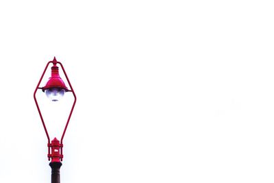 Low angle view of lamp post against clear sky