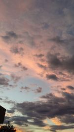 Low angle view of cloudy sky at sunset