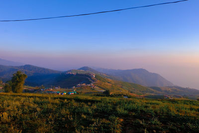 Scenic view of landscape against sky during sunset