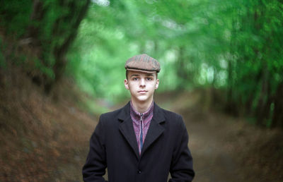 Portrait of young man standing outdoors