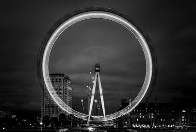 Low angle view of ferris wheel against sky