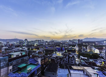 High angle view of buildings against sky during sunset