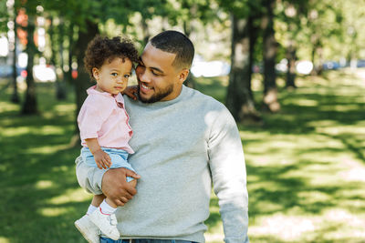 Portrait of mother with baby outdoors