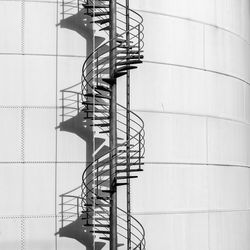 Low angle view of electricity pylon against sky
