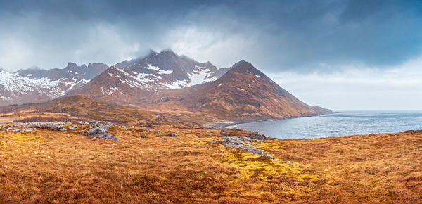 Scenic view of snowcapped mountains against sky