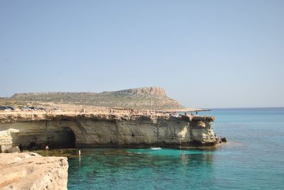 Scenic view of bay against clear sky