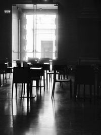 Empty chairs and table in room