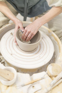 Midsection of man working at workshop