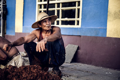 Portrait of man sitting in park