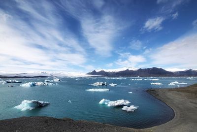 Scenic view of sea against sky during winter